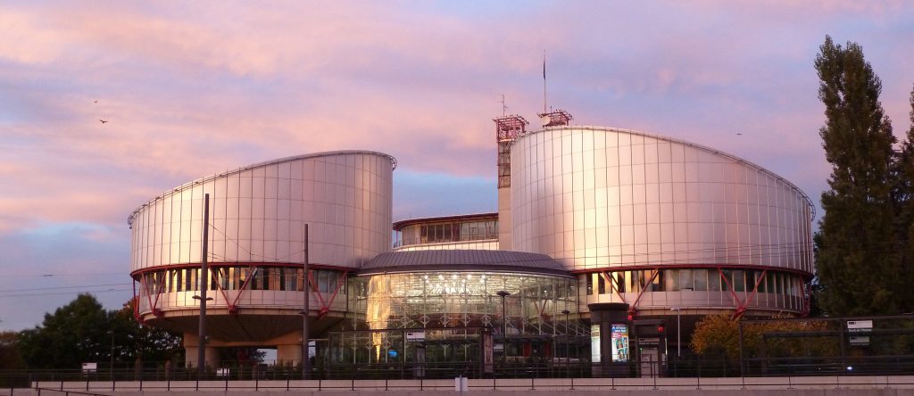 A photo of the European Court of Human Rights at sunset