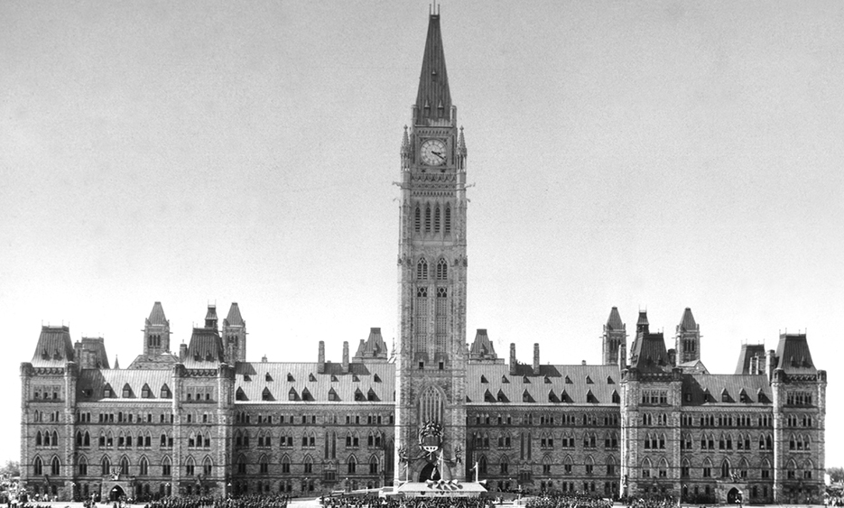 A black and white photo of the Parliament of Canada